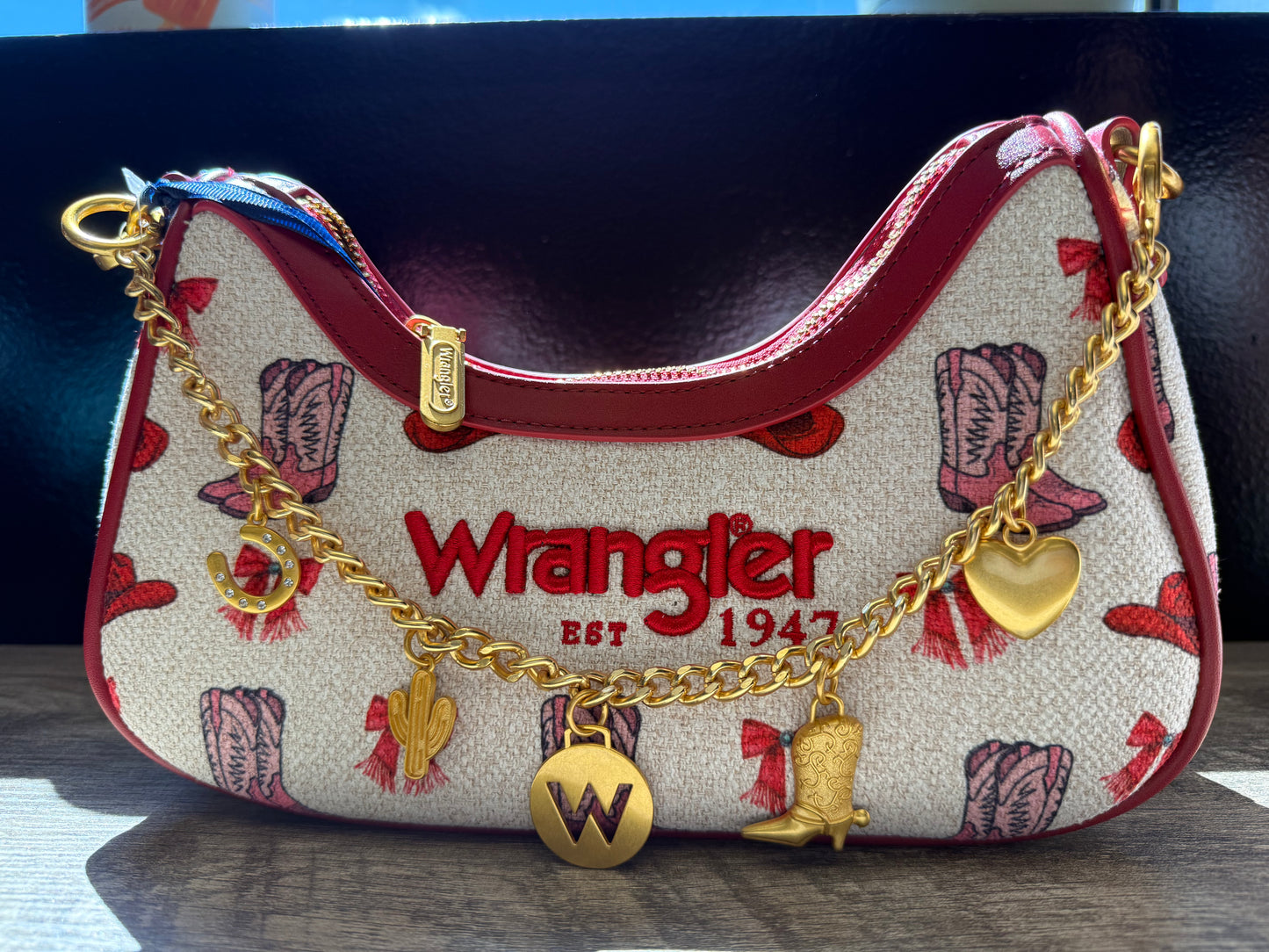 Red charm wrangler purse